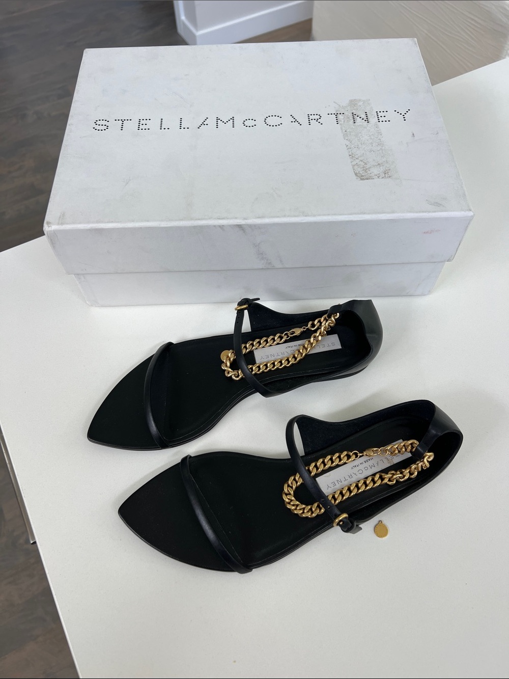 Stella McCartney bella black leather flat open toe sandals with gold ankle chain